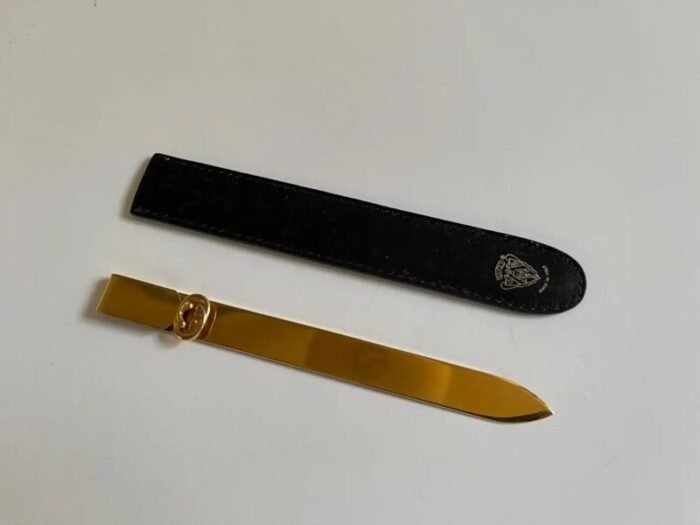 1970s gucci gold metal letter opener in black leather case 0654