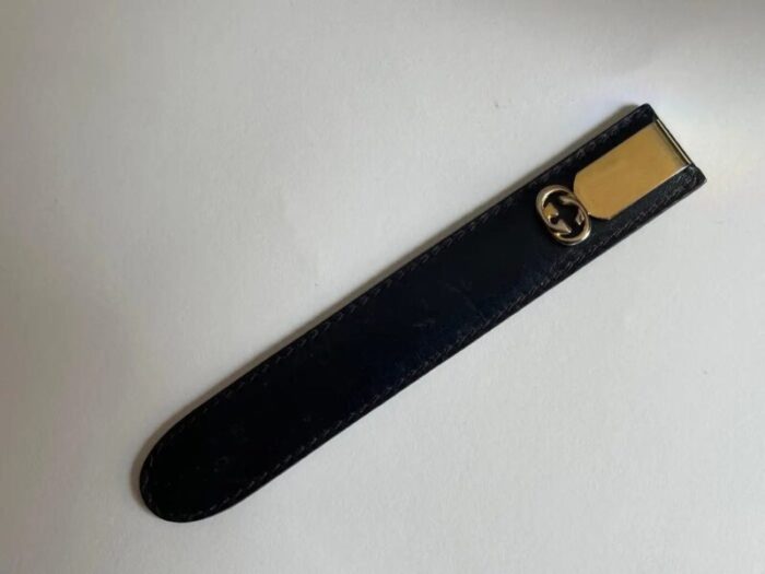 1970s gucci gold metal letter opener in black leather case 4081