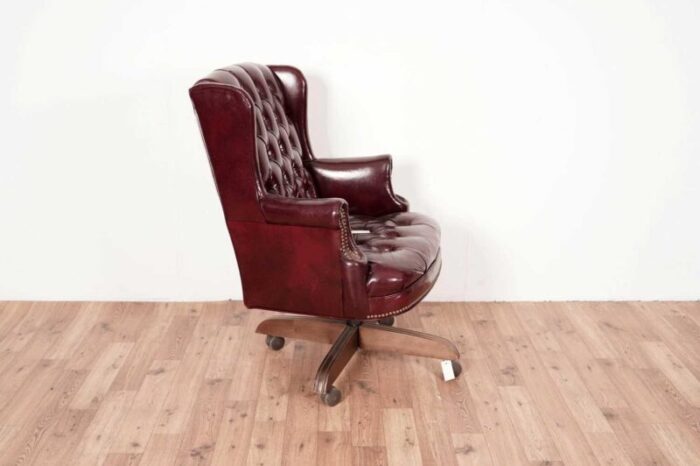 20th century button back chesterfield revolving desk chair with polished burgundy red leather upholstery with tilt action 1970s 4790