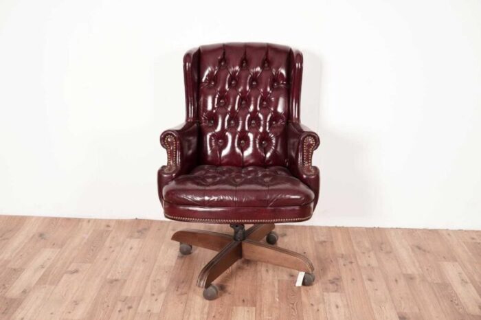 20th century button back chesterfield revolving desk chair with polished burgundy red leather upholstery with tilt action 1970s 7593