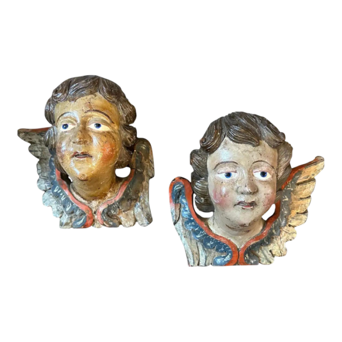 a pair of 1750s baroque lacquered wood sculptures of angel heads with wings 3769