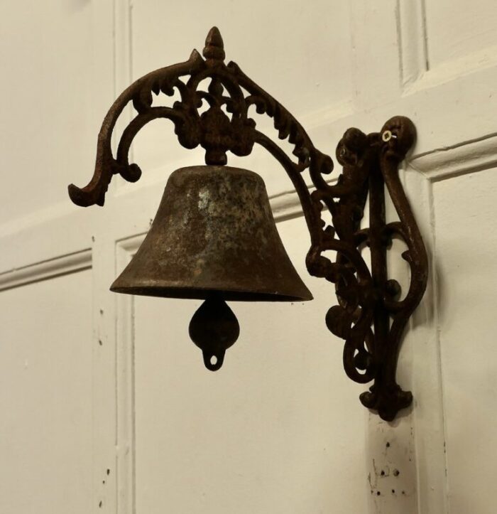 cast iron out door bell on bracket 1920s 2