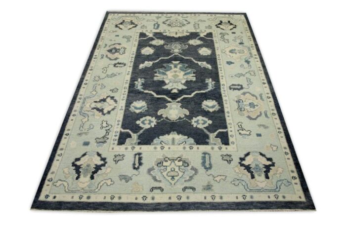 early 21st century charcoal and blue floral design handwoven wool turkish oushak rug 411 x 610 1976