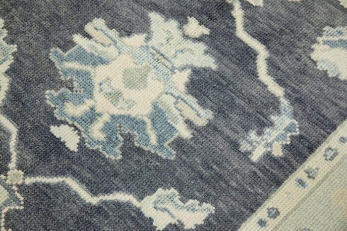 early 21st century charcoal and blue floral design handwoven wool turkish oushak rug 411 x 610 7136