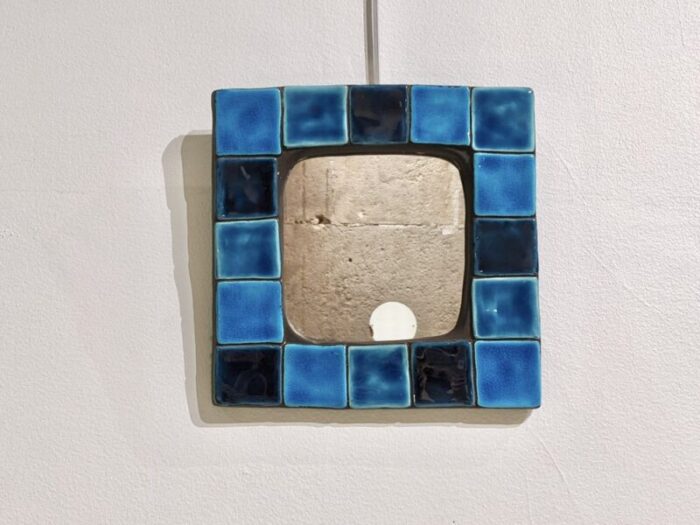 enamelled ceramic wall mirror by mithe espelt 1