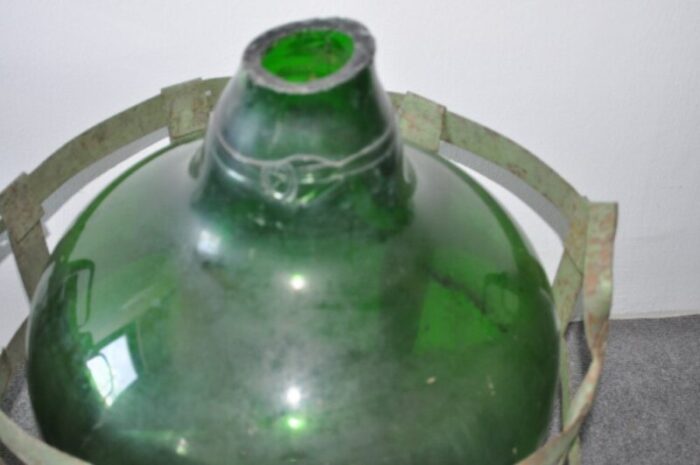 large vintage glass bottle with metal basket 2