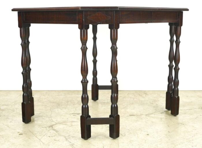 mid 20th century dark stained mahogany spindle legs dining table 7102