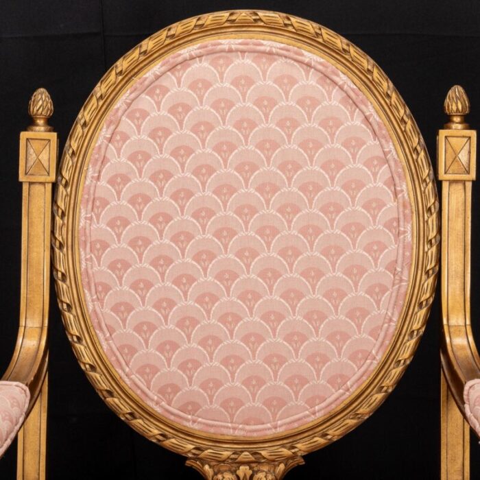 mid 20th century pair of french louis xvi style cameo back fauteuil armchairs in gilt and pink 6477