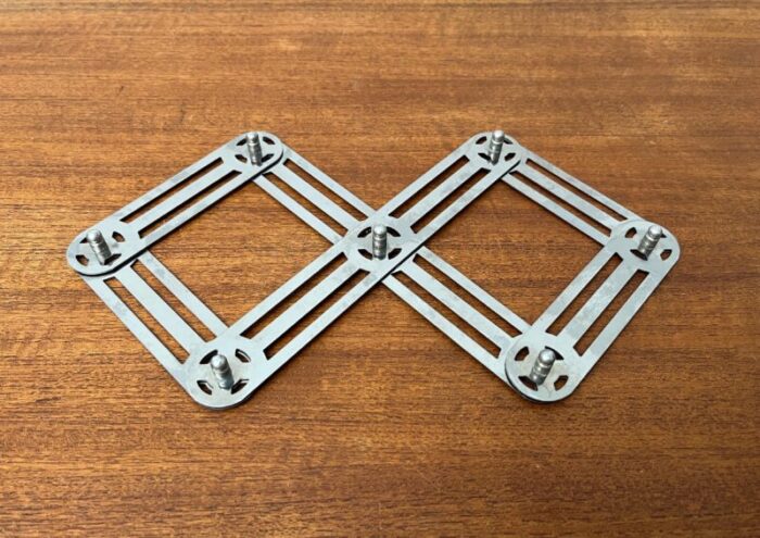 postmodern german metal extendable trivet coaster from zack 3215