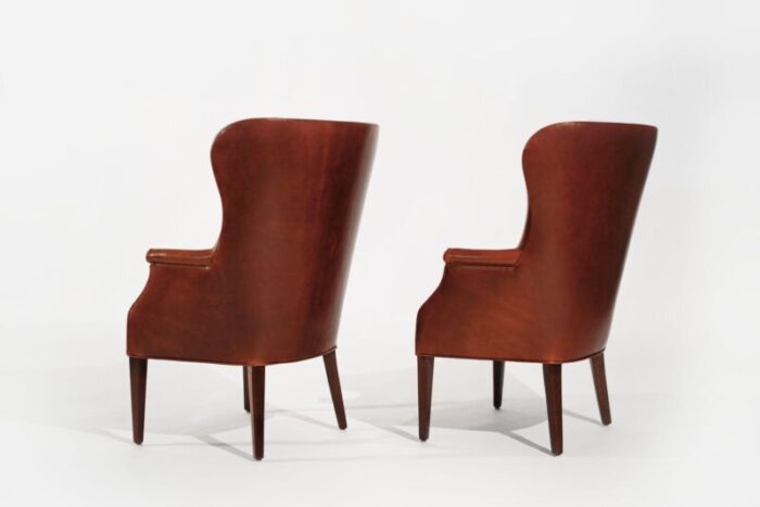 set of wingback club chairs in cognac leather c 1950s 5573