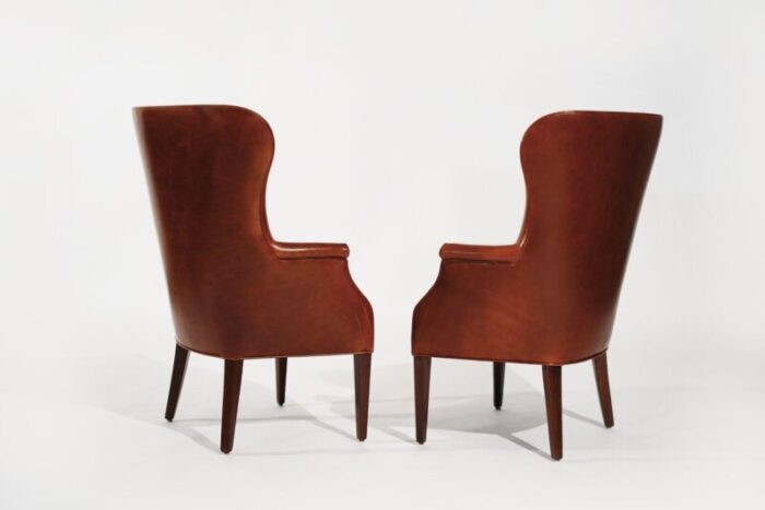 set of wingback club chairs in cognac leather c 1950s 6017