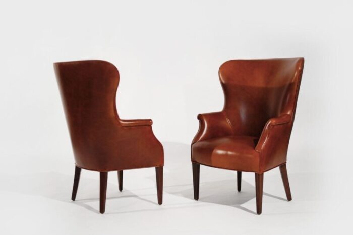 set of wingback club chairs in cognac leather c 1950s 6413