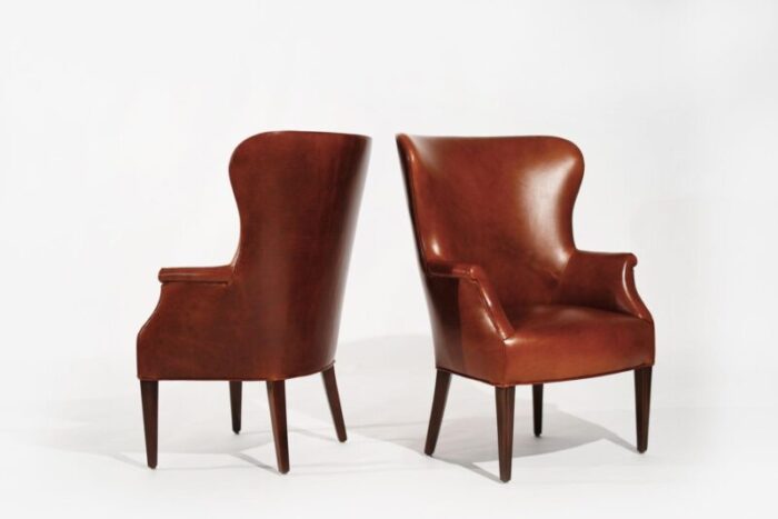 set of wingback club chairs in cognac leather c 1950s 8210