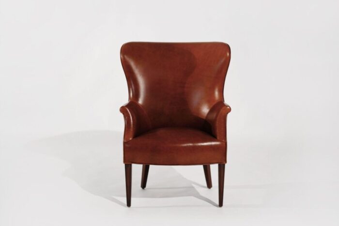 set of wingback club chairs in cognac leather c 1950s 9170