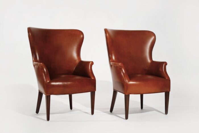 set of wingback club chairs in cognac leather c 1950s 9214